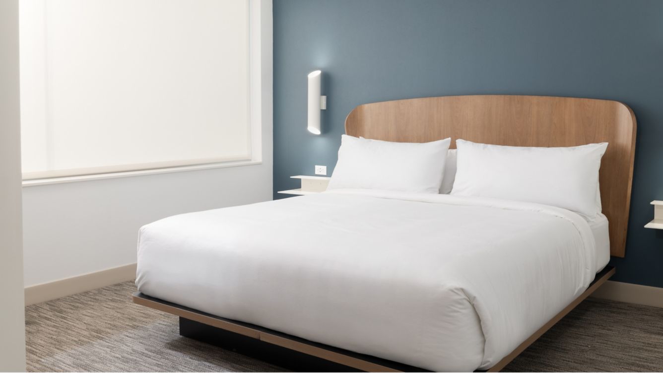 Plush king bed with modern decor - Element by Marriott Las Vegas Airport Guest Rooms ADA Accessible King Bed Bedroom