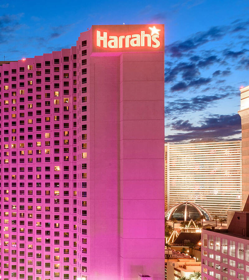 Harrah's Las Vegas hotel tower illuminated at dusk