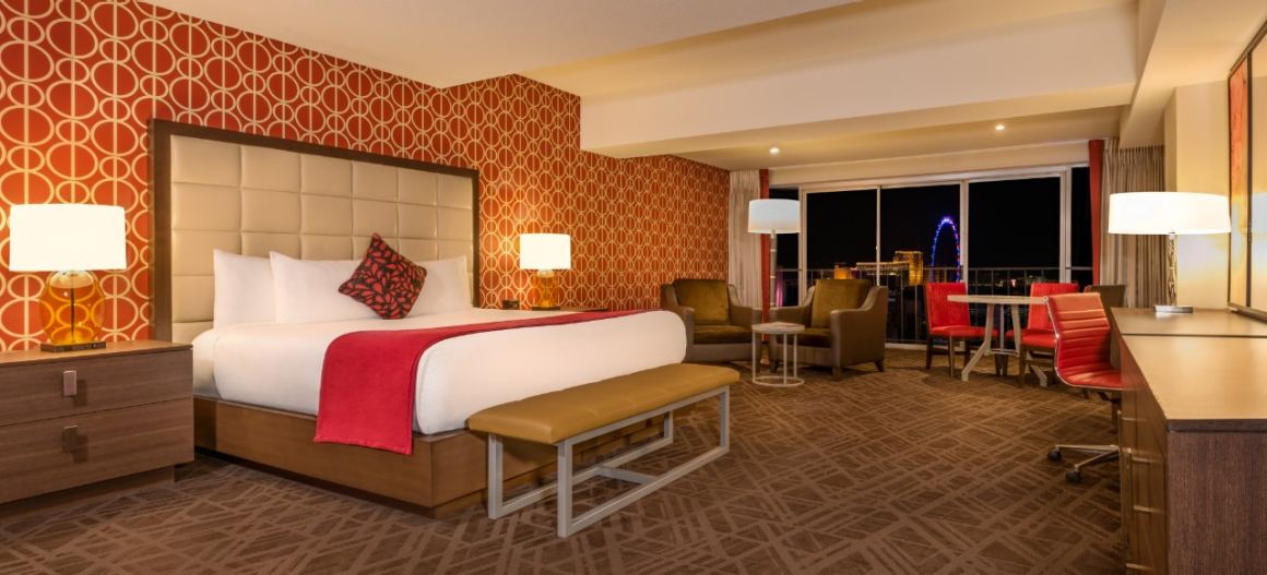 Horseshoe Las Vegas studio king bedroom with sitting area and city view