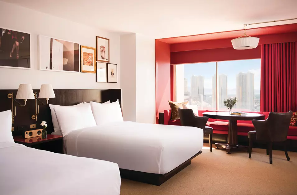 Park MGM guest room with two beds and red window seating
