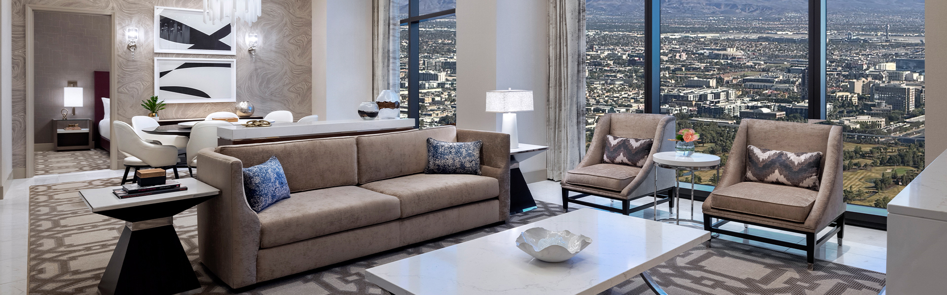 Resorts World city-view entertainment suite living and dining area