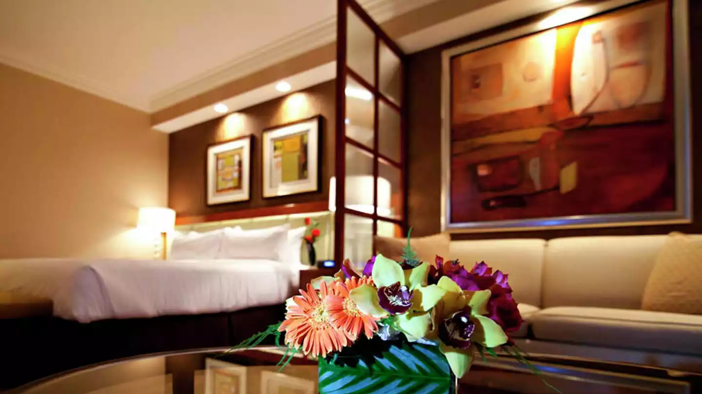 The Signature at MGM Grand Deluxe Suite sitting area and bedroom